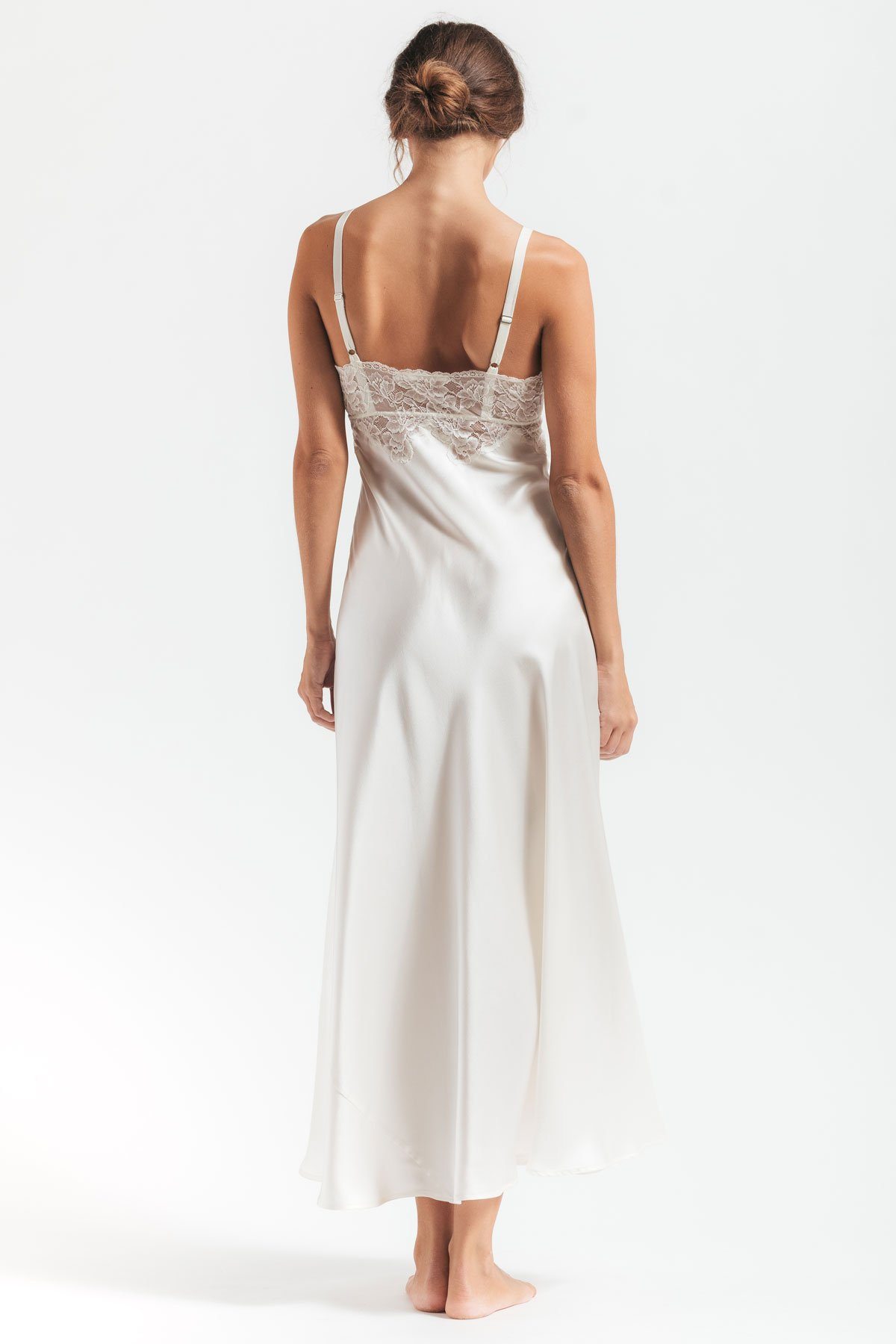 Backview of model wearing Morgan vintage long silk sleeping gown in ivory